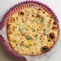 Garlic Naan · Fluffy flatbread topped with garlic.