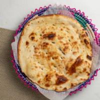 Butter Naan · Fluffy flatbread topped with butter.