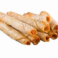 Chicken Taquitos · Six pieces of grilled and seasoned  with chicken, Monterey Jack cheese and Mexican spices in...