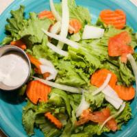 House Salad · Green leaf lettuce, tomato, onion, carrot, and cheese on request.