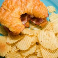 Brie & Bacon Croissant · Toasted sandwich. Strawberry jelly available on request.  Served with chips.