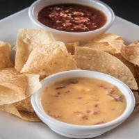 Cheese Dip And Salsa · Fresh salsa, Rotel cheese dip, and tortilla chips.