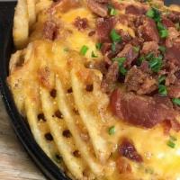 Loaded Cheese Fries · Cornmeal coated waffle fries, cheese sauce, bacon bits, green onions