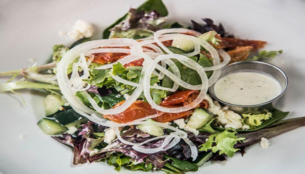 Side House Salad · Mesclun mix, roasted tomatoes, chopped cucumber, shaved vidalia onion, feta cheese, choice of dressing. Gluten-free and vegetarian.