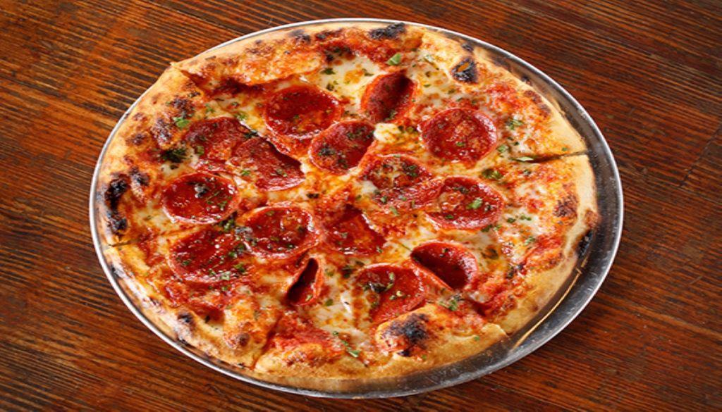 Pepperoni Pizza · Pizza sauce, Italian pepperoni, provolone, mozzarella, cheddar and grated Parmesan.
