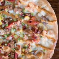 Cajun Crawdad Pizza · Crawfish tail meat, bacon, peppers, onion, jalapeno and remoulade swirl.