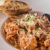Jambalaya Pasta · Chicken, andouille, and shrimp tossed in Cajun spices with linguine, grilled baguette