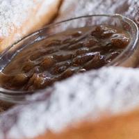 Beignets · Powdered sugar and pecan praline dipping sauce