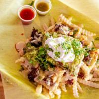 Borracho Fries · Choice of carne, French fries, cheese, guacamole, and sour cream.