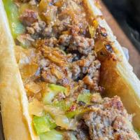 Philly Cheese Steak · Onions, pepper's, cheese and marinated beef in a 8