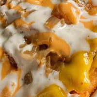 Loaded Stack · Your choice of fries or tots, Impossible meat, vegan cheese, grilled onions, smothered with ...