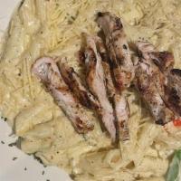 Grilled Chicken & Pasta Alfredo · Homemade Alfredo sauce with vegetables tossed in penne pasta. Topped with grilled chicken br...