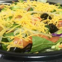 Large Garden Salad · Freshly made with lettuce, diced tomatoes, onions, green peppers, black olives, shredded car...