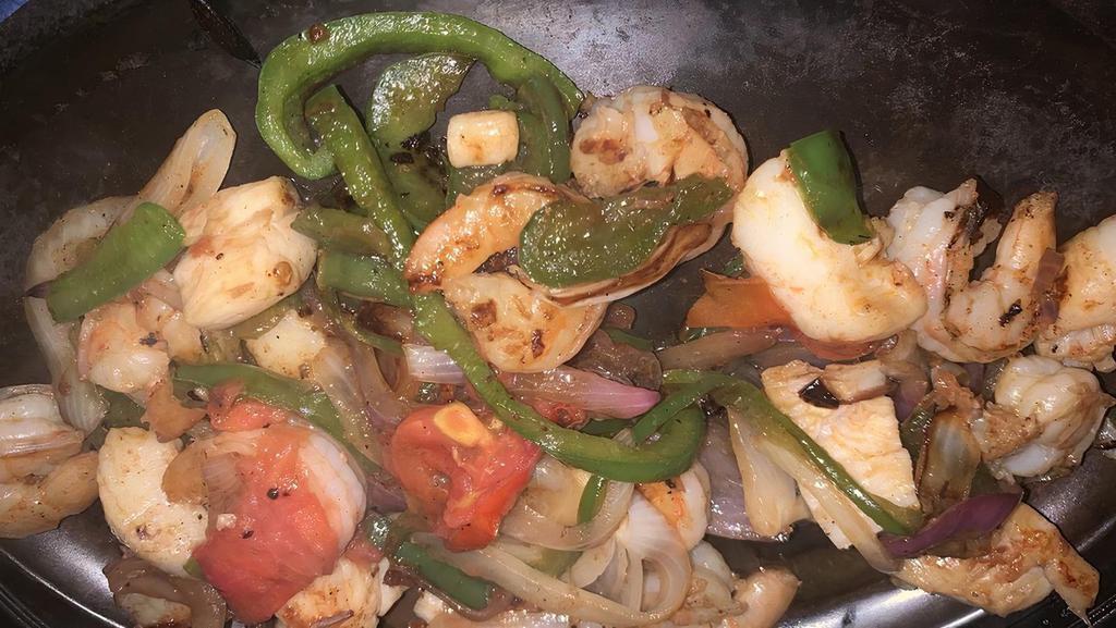 Del Mar Fajitas · Try our seafood fajitas with shrimp and scallops cooked with vegetables. Served with rice.