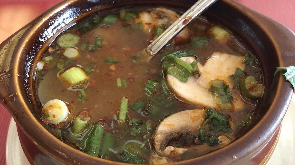 Hot And Sour (Tom Yum) · Spicy and sour clear broth with lemon grass, kaffir lime leaves, galangal, onion, mushroom, tomatoes, and Thai Basil.  Garnished with green onions and cilantro. Due to supply chain issues we may be out of certain ingredients.
