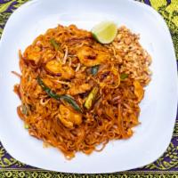 Pad Thai · A traditional Thai noodle dish. Stir-fried with egg, scallions, and bean sprouts.  Served wi...