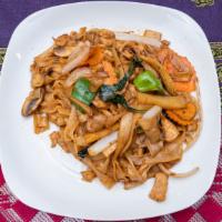 Drunken Noodles (Pad Kee Maow) · Wide rice noodles stir-fried with egg, Thai basil leaves, bell peppers, mushrooms, baby corn...