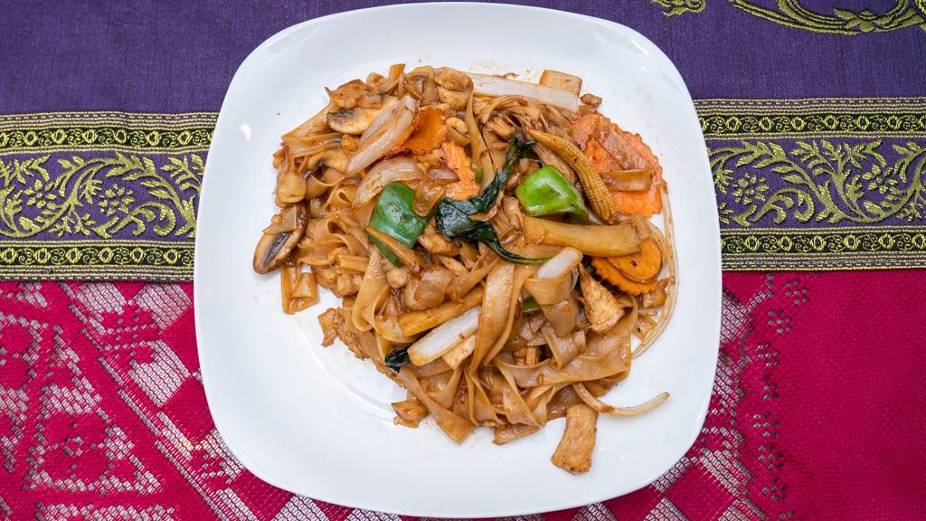 Drunken Noodles (Pad Kee Maow) · Wide rice noodles stir-fried with egg, Thai basil leaves, bell peppers, mushrooms, baby corn, carrots, bamboo shoots, tomatoes, and onions in our signature sweet and tangy chili brown sauce. Due to supply chain issues we may be out of certain ingredients.