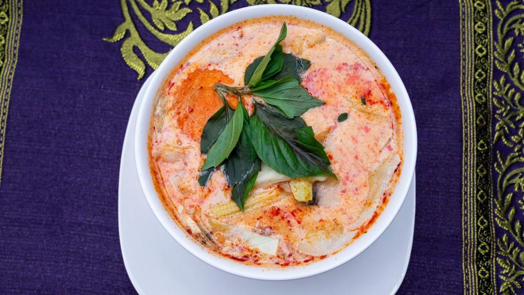 Red Curry · A popular curry cooked with a mixture of bell peppers, bamboo shoots, mushrooms, carrots, broccoli, cabbage, onions, baby corn, and fresh Thai basil leaves.  Served with steamed Jasmine rice. Due to supply chain issues we may be out of certain ingredients.