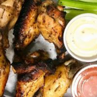 Dante'S Grilled Wings · Jumbo marinated wings grilled over an open flame served with a side of our special spicy inf...