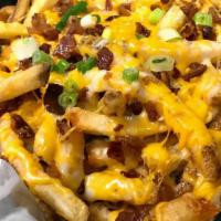 Cheesy Fries · Hand-cut fries oven baked with cheddar and Monterrey jack cheese then topped with green onio...