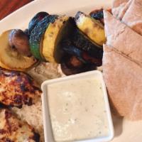 Grilled Chicken Platter · Saffron marinated all natural grilled chicken served over basmati rice with marinated and gr...