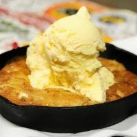 Fresh Baked Skillet Cookie · White chocolate and salted caramel cookie baked in a warm skillet.