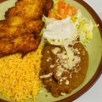 Milanesa · Thinly sliced breaded chicken or steak fried to a golden brown, served with lettuce, tomato,...