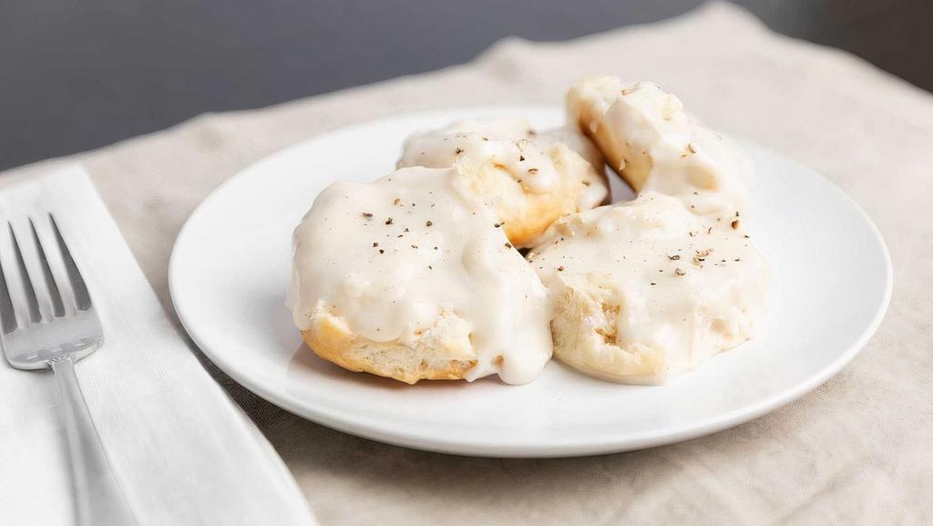 Biscuits & Gravy · Two buttermilk biscuits served open-faced and smothered in our traditional white gravy.