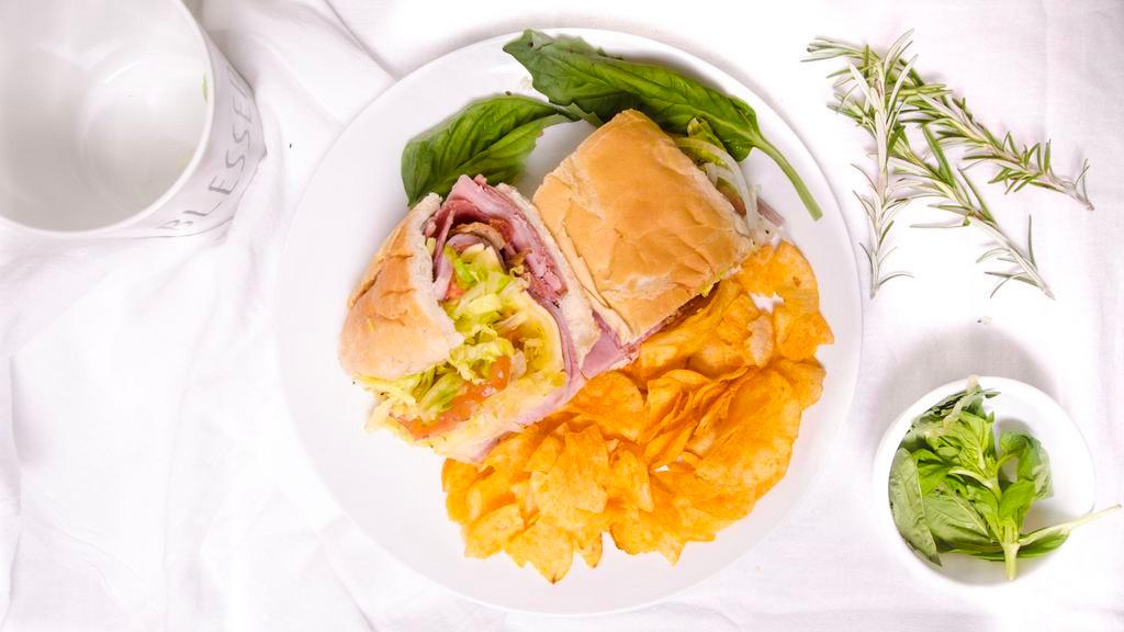 Italian Gladiator Sub (Half) · Comes with grinder patty, baked ham, pepperoni, bacon, provolone & american cheese, topped with lettuce, tomato, onions, spices and dressing
