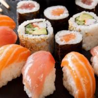 Sushi Sample (Raw) · Chef choice nine pcs sushi with tuna roll or California roll.