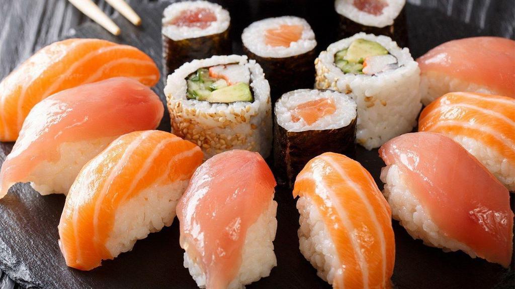 Sushi Sample (Raw) · Chef choice nine pcs sushi with tuna roll or California roll.