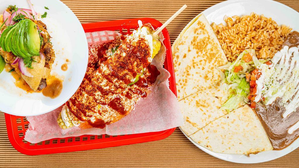 Ahogado (Plate) · 3 Ahogado tacos with side rice and bean.