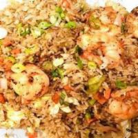 Jumbo Shrimp Fried Rice · Served with onion, egg, carrot, lettuce, scallion and a shrimp sauce.