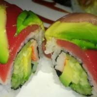 Rainbow Roll · Eight pieces. Crab, avocado, cucumber topped with assorted fish and avocado.

Items are serv...