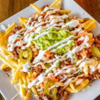 Frida'S Fries · Bed of Seasoned Fries Topped with Grilled Steak, Pico de Gallo, Jalapeños, Guacamole, and So...