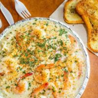 Large Seafood Alfredo · Crab meat and shrimp pasta in a creamy homemade alfredo sauce with garlic bread.