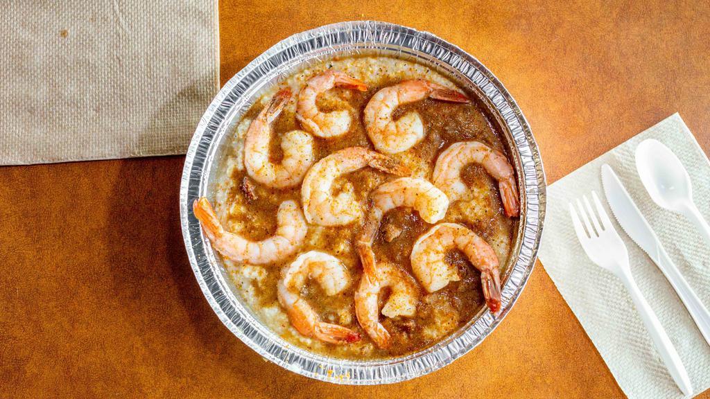 Large Shrimp & Grits · Plump shrimp in a low country turkey sausage gravy with a little kick, served over creamy cheese grits.