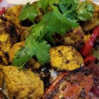 Chicken Kabob W/Grilled Tomato, Pita Bread · Marinated and grilled chicken breast, basmati rice, barberry saffron sauce ( you can sub pot...