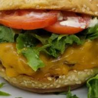 Cheeseburger · 6 oz hand pattied beef, kaiser bun, cheddar, lettuce, tomato, and pickles, dijonaise sauce (...