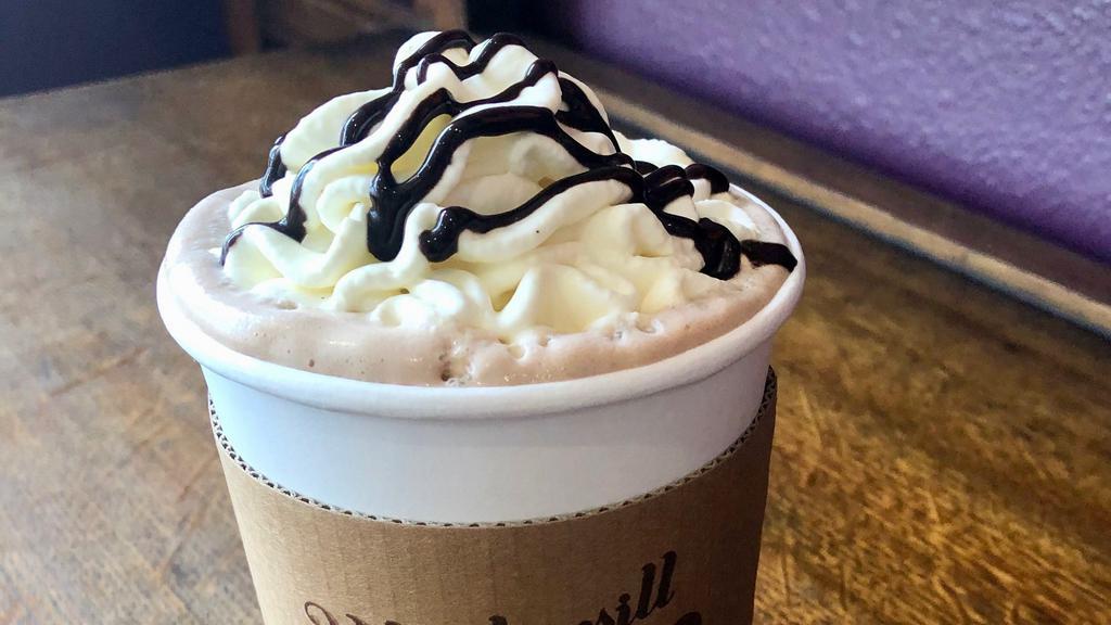 Signature Hot Chocolate · Made with our house recipe Dark Chocolate Syrup, and topped with Vanilla Bean Whipped Cream if you wish. Choice of whole or soy milk.