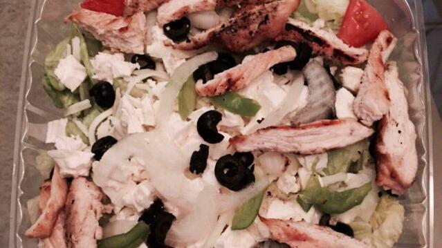 Grilled Chicken Salad · Chicken, onions, tomatoes, green peppers, black olives, mozzarella, cheddar, and mixed lettuce.