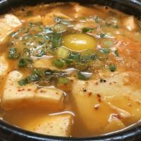 E-8. Soondubu Jjigae · Hot and spicy soft tofu soup.
-Seafood Soondubu 
-Beef Soondubu 
-Kimchi Soondubu 
-Vegetabl...