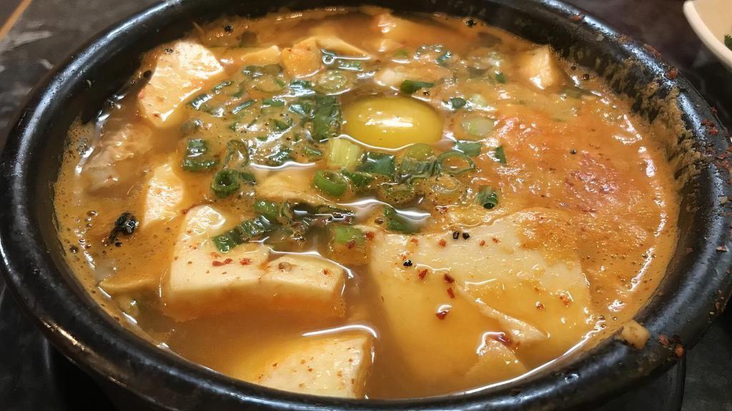 E-8. Soondubu Jjigae · Hot and spicy soft tofu soup.
-Seafood Soondubu 
-Beef Soondubu 
-Kimchi Soondubu 
-Vegetable Soondubu