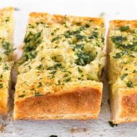 Cheesy Garlic Bread · Fresh Italian bread topped with real fresh garlic and lots of mozzarella cheese. Served with...