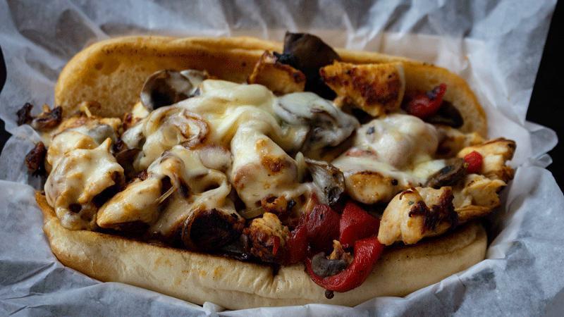 Chicken Philly · Grilled chicken breast, grilled onions, roasted red peppers, mushrooms, provolone, & garlic mayo on a hoagie roll