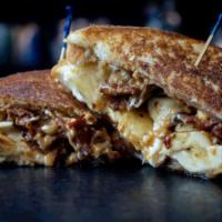 Velvet Elvis · Crunchy peanut butter, spicy honey, cream cheese, banana, & bacon on Texas Toast