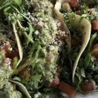 Kick'N Chicken Tacos · Garlic lime marinated grilled chicken, quest fresco, lettuce, pico de gallo & garlic-parsley...