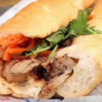 Grilled Chicken Banh Mi · Grilled Lemongrass Chicken. Served on golden bakery bread dressed with pickled carrots, daik...