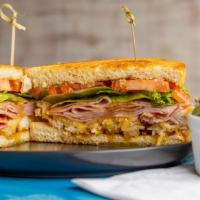 Transom (Cordon Bleu) · Grilled brioche toast topped with fried chicken, sliced ham, Swiss cheese, lettuce, tomato a...